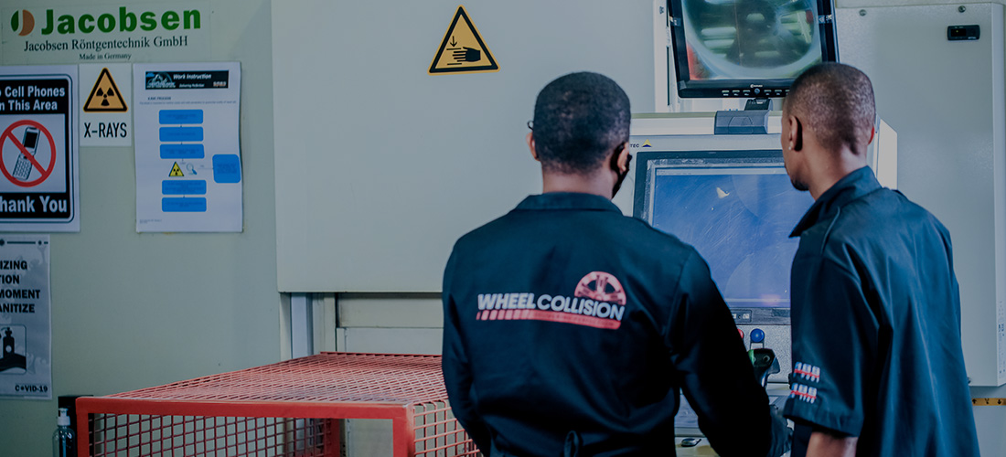safety-assurance Two wheel collision technicians operating advanced machinery